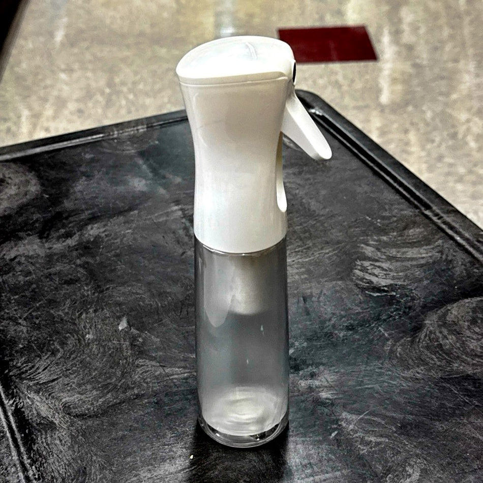 WHITE EZ Mist, a refillable 10oz bottle / sprayer combo that provides an aerosol-type mist without any chemical propellants.